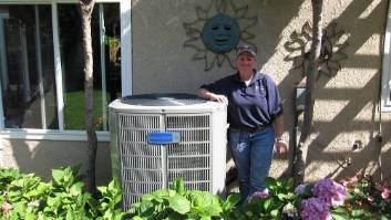 Kelly Mae standing next to an AC unit